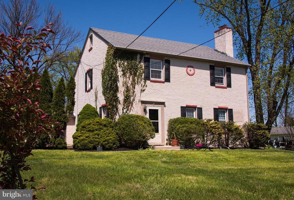 919 Valley Forge Road, Unit 1 Phoenixville, PA 19460 - Photo 1 of 25 a front view of a house with a garden