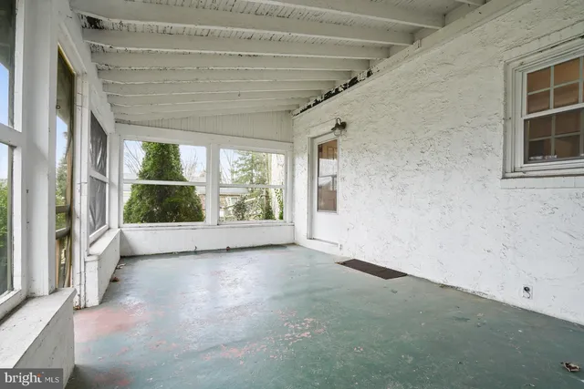 a view of an empty room with a balcony