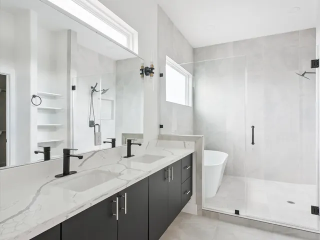 a white bath tub sitting next to a window