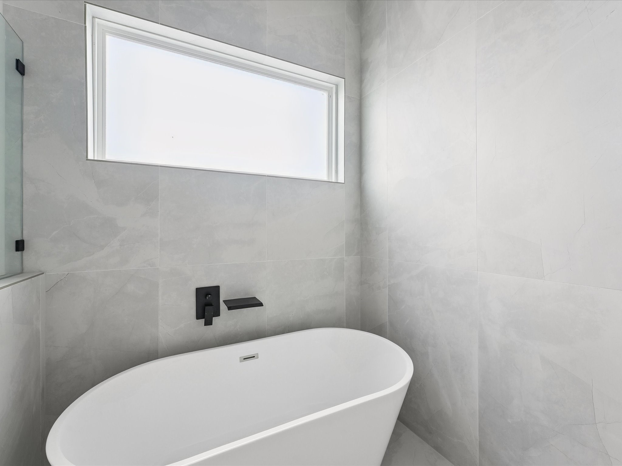 3510 Saltus Street Houston, TX 77003 - Photo 23 of 36 a white bath tub sitting next to a window