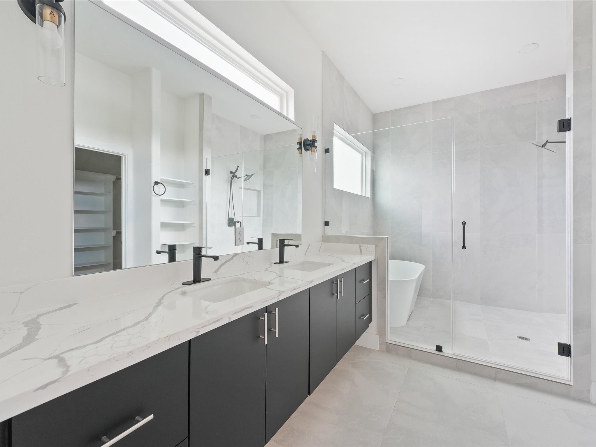3510 Saltus Street Houston, TX 77003 - Photo 24 of 36 a bathroom with double sink and a mirror