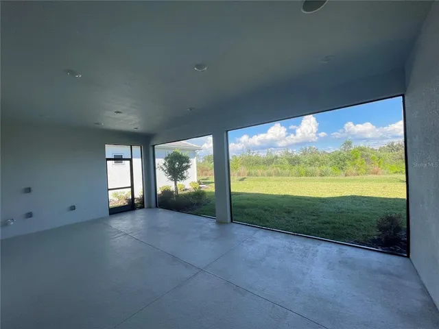 a view of a room next to a yard