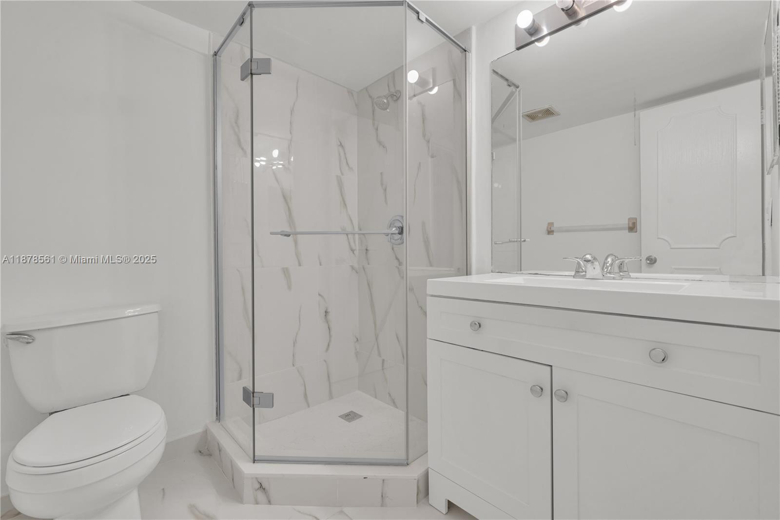 9355 Southwest 8th Street, Unit 425 Boca Raton, FL 33428 - Photo 19 of 42 a bathroom with a sink a toilet and shower