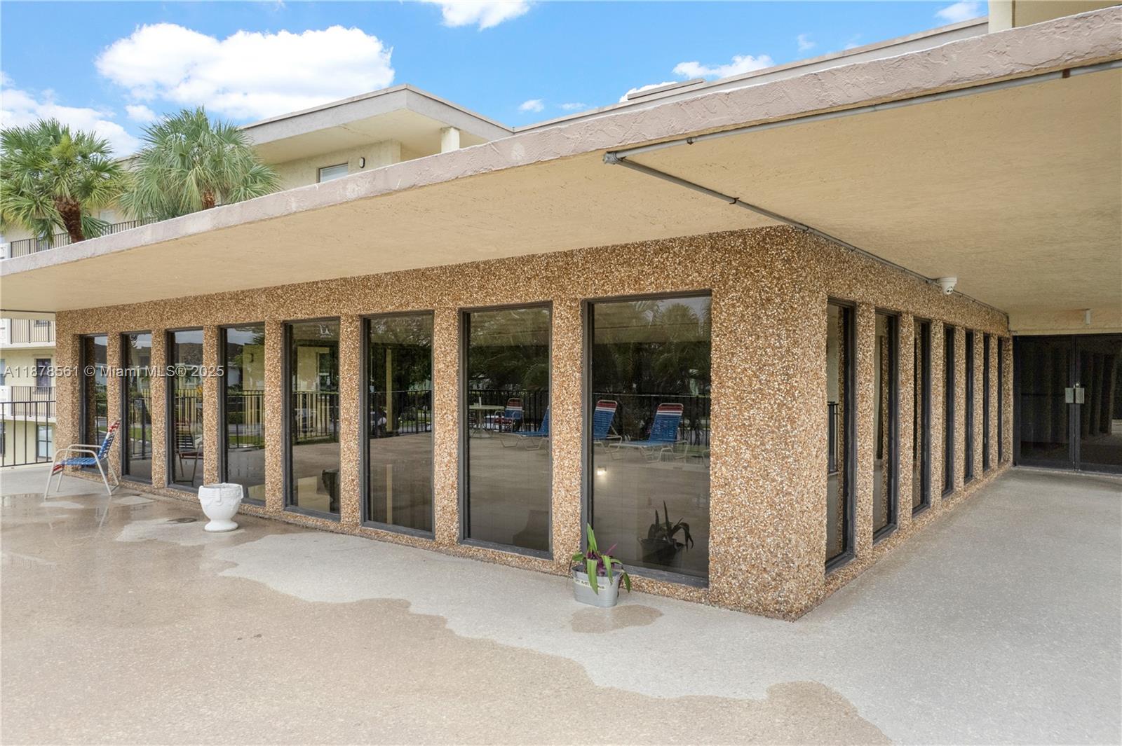 9355 Southwest 8th Street, Unit 425 Boca Raton, FL 33428 - Photo 35 of 42 a porch with seating space