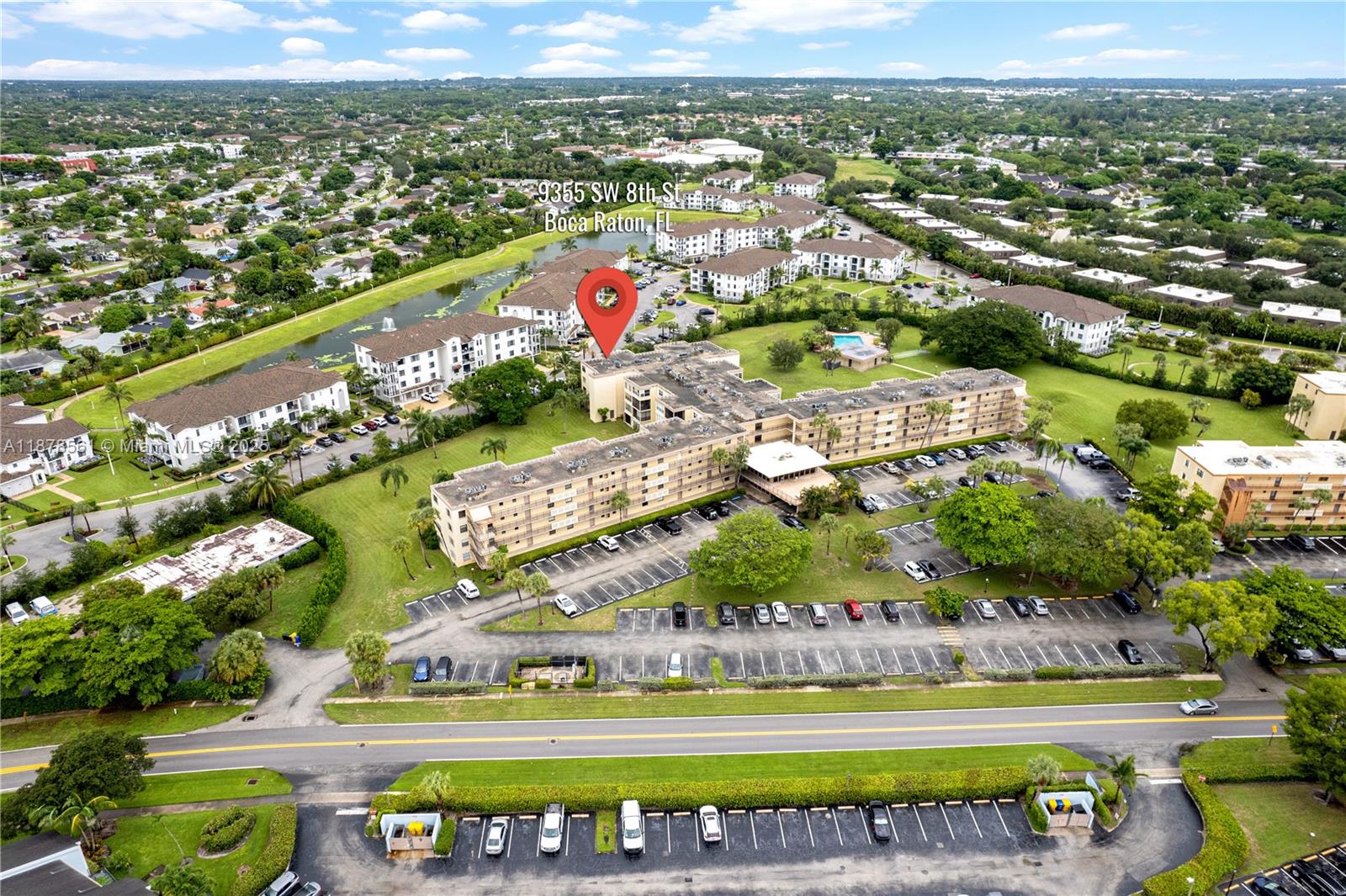 9355 Southwest 8th Street, Unit 425 Boca Raton, FL 33428 - Photo 38 of 42 an aerial view of a city with lots of residential buildings ocean and mountain view in back