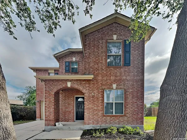 a front view of a house with yard