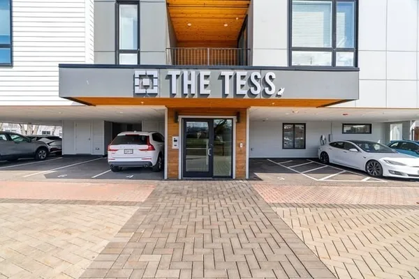 a view of a car parked in front of a building