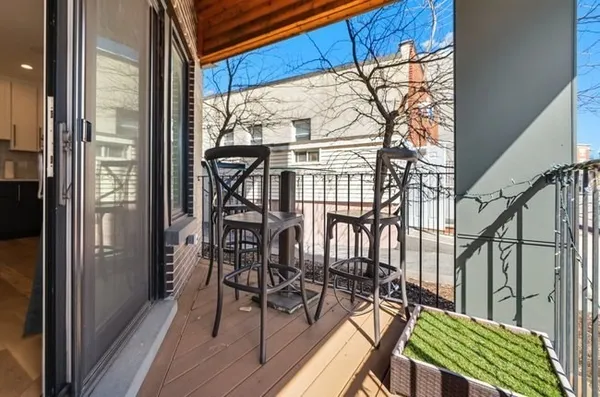 a view of a balcony with chairs
