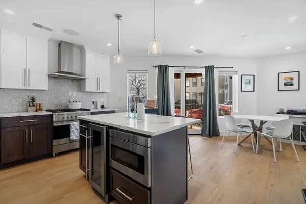 a kitchen with a sink stove and cabinets