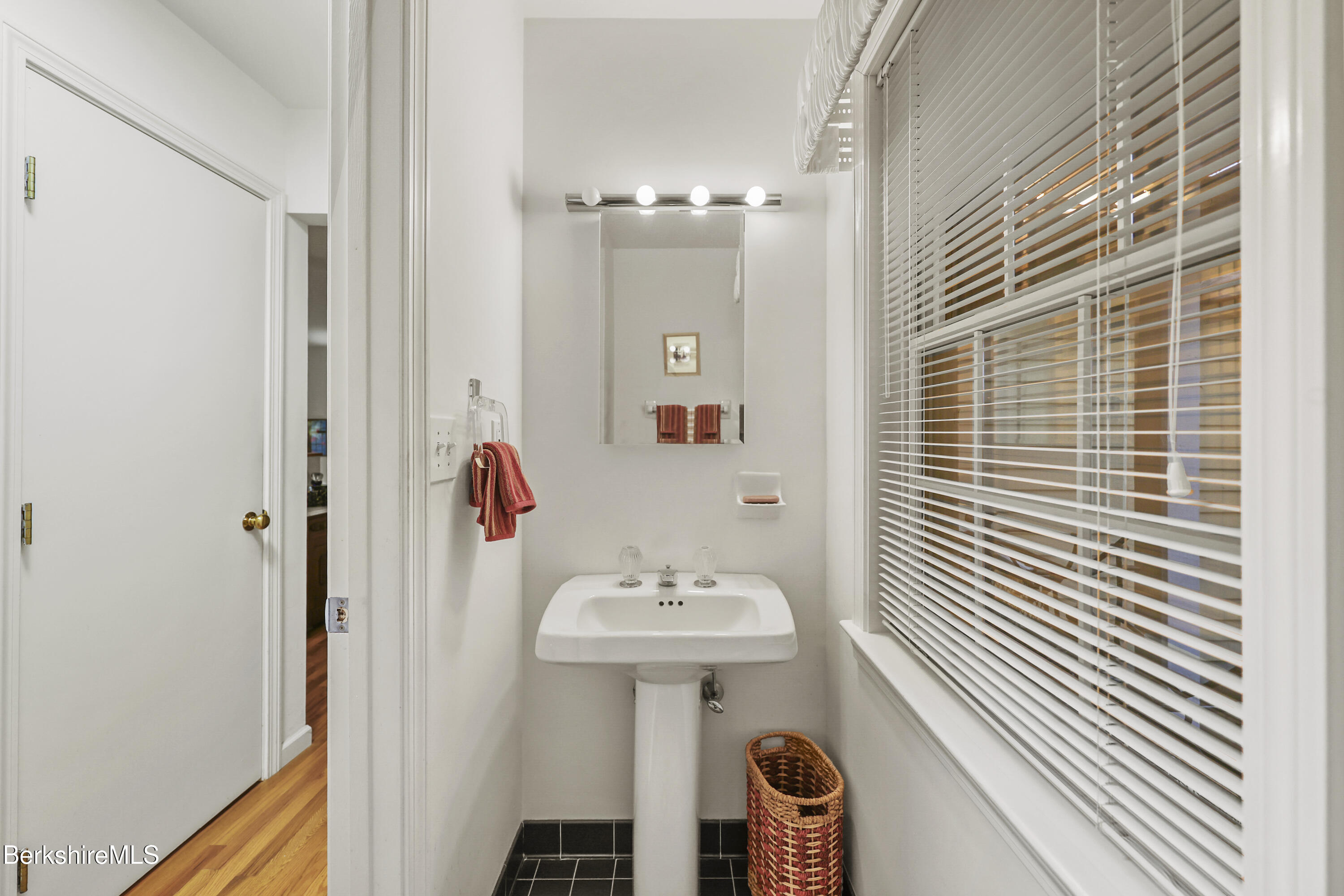 1136 Barker Road, Unit 27 Pittsfield, MA 01201 - Photo 14 of 30 a bathroom with a sink and a mirror