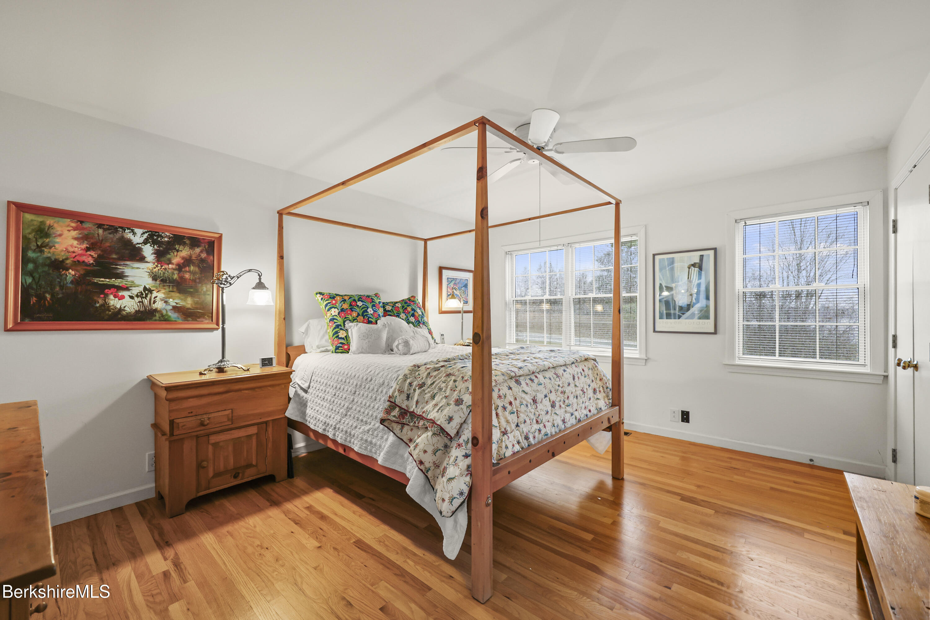 1136 Barker Road, Unit 27 Pittsfield, MA 01201 - Photo 15 of 30 a bedroom with a bed and wooden floor