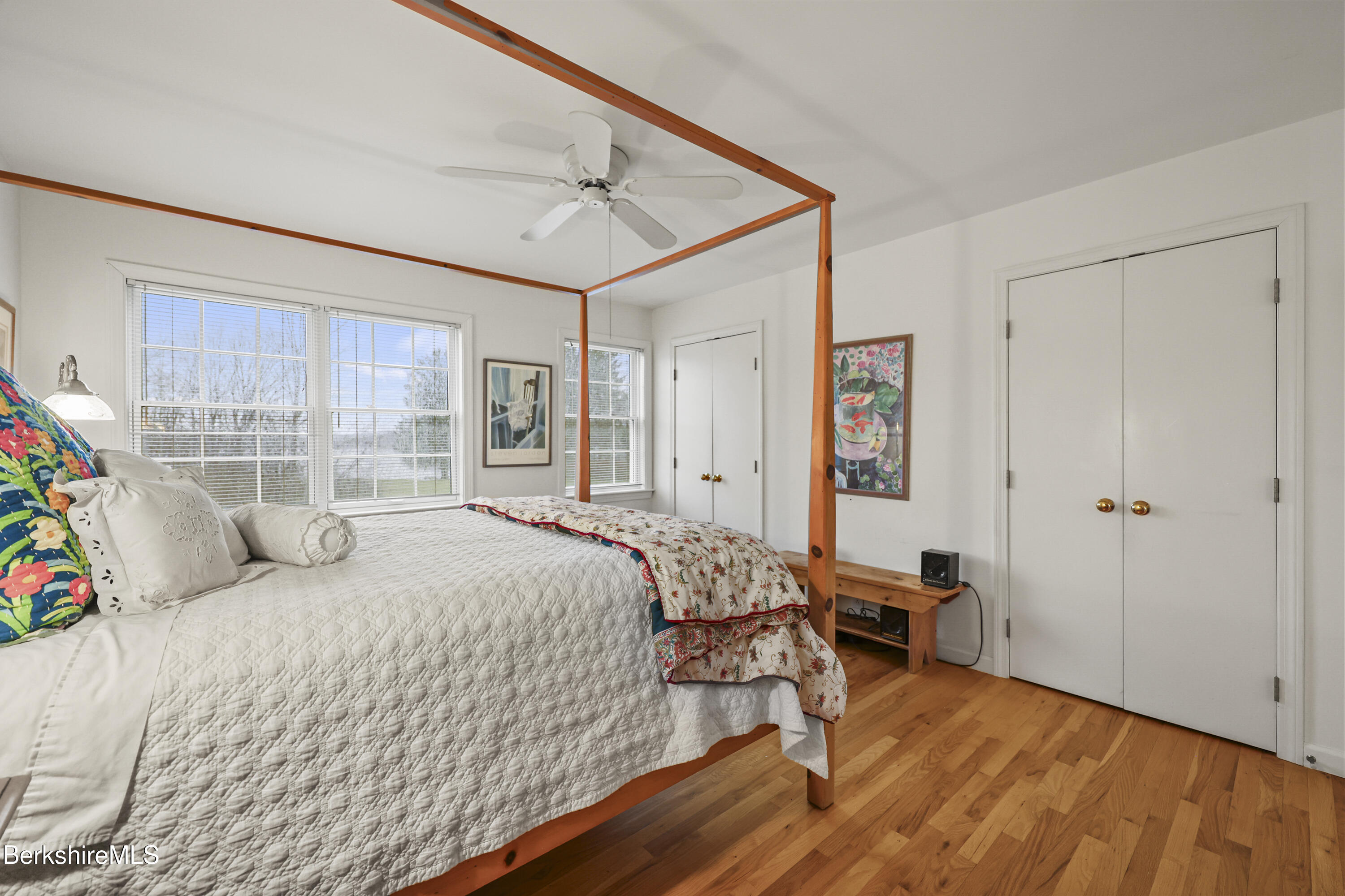 1136 Barker Road, Unit 27 Pittsfield, MA 01201 - Photo 16 of 30 a bedroom with a bed and a table in it