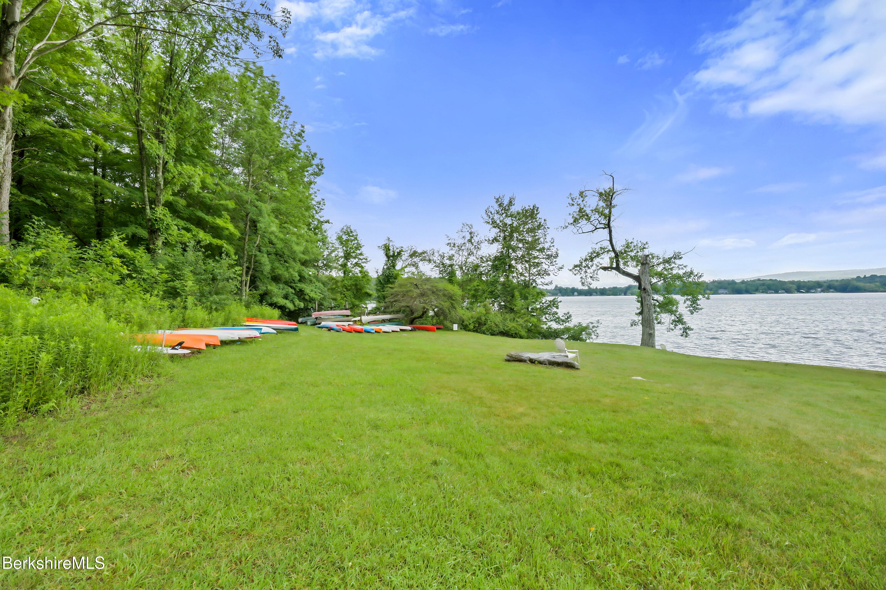 1136 Barker Road, Unit 27 Pittsfield, MA 01201 - Photo 26 of 30 a view of a golf course with a lake