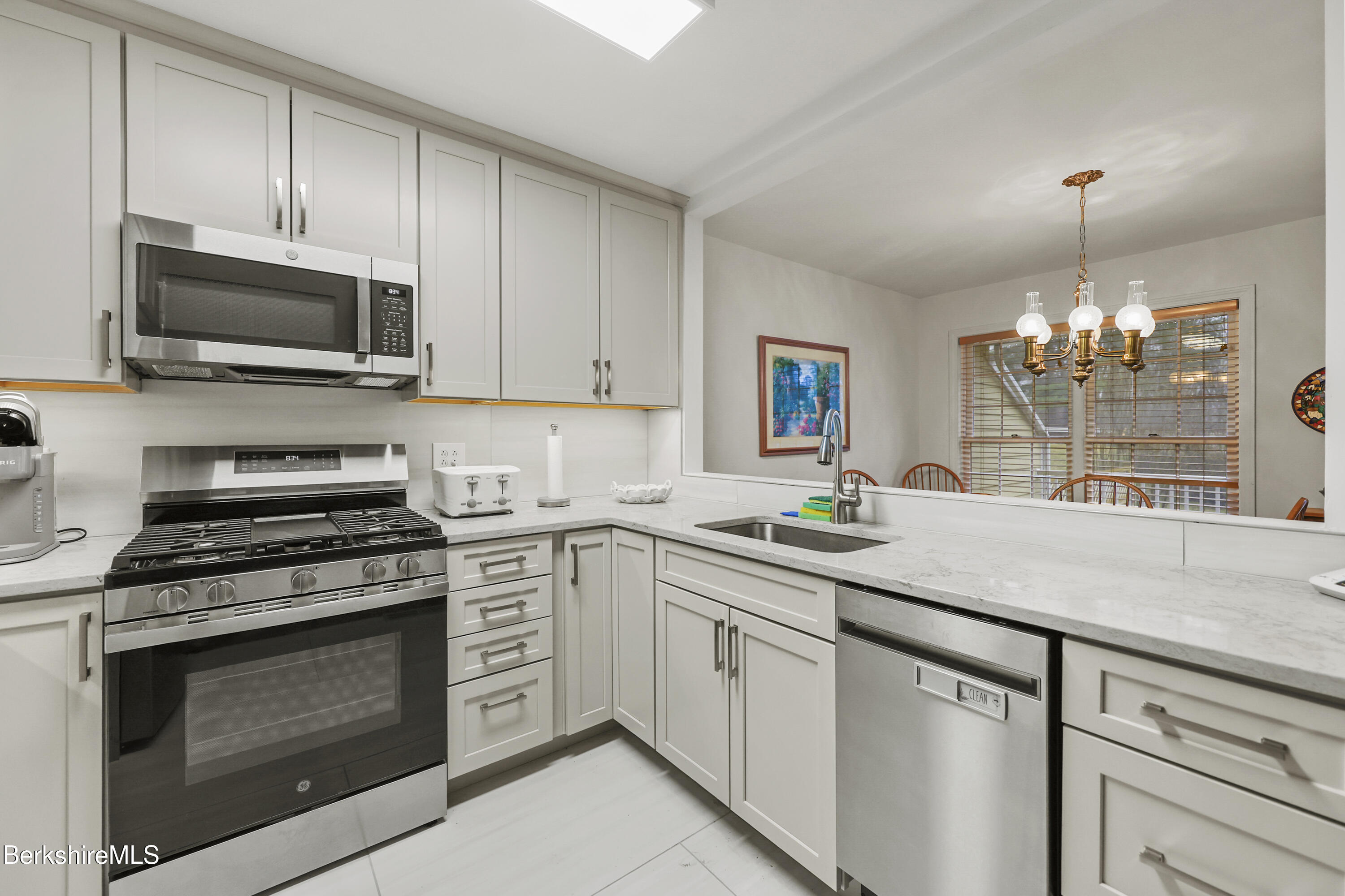1136 Barker Road, Unit 27 Pittsfield, MA 01201 - Photo 10 of 30 a kitchen with cabinets stainless steel appliances and a counter space
