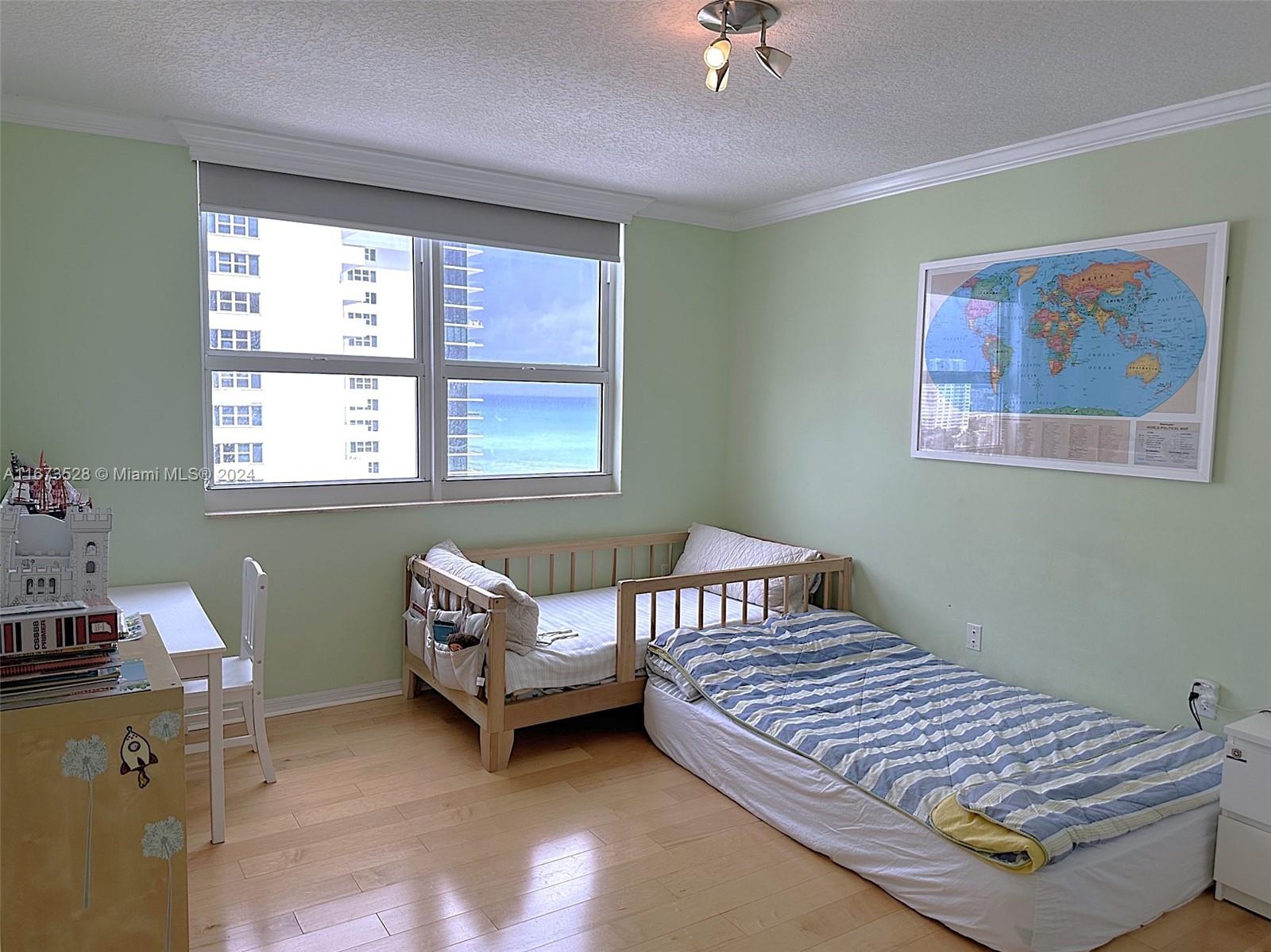 2080 South Ocean Drive, Unit 1602 Hallandale Beach, FL 33009 - Photo 11 of 38 a bedroom with a bed and a window
