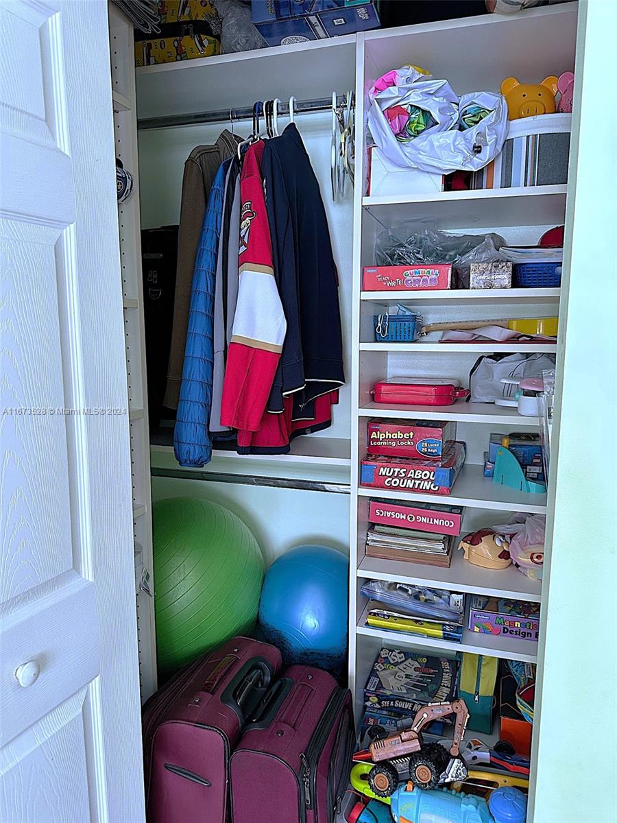 2080 South Ocean Drive, Unit 1602 Hallandale Beach, FL 33009 - Photo 12 of 38 a view of a closet with storage