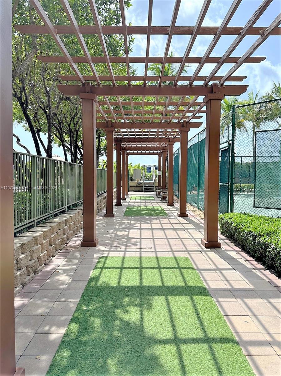 2080 South Ocean Drive, Unit 1602 Hallandale Beach, FL 33009 - Photo 28 of 38 a view of porch with a table and chairs