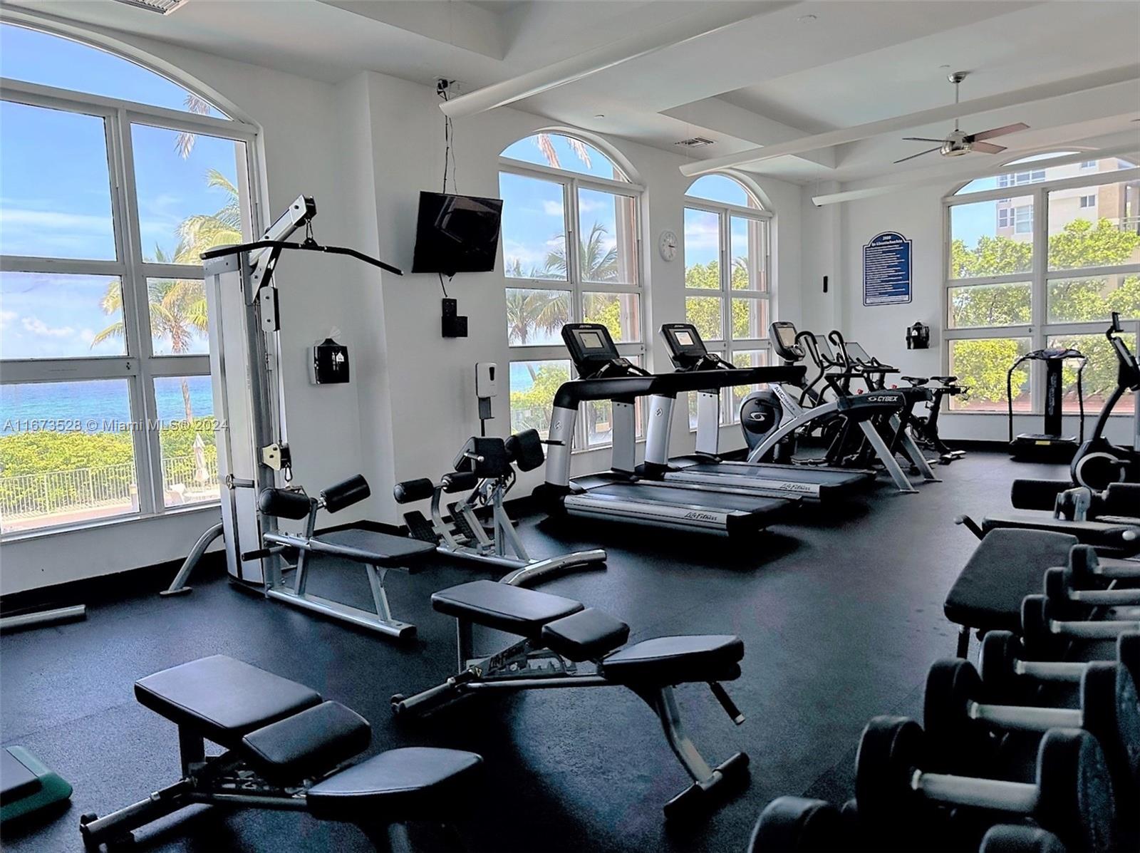 2080 South Ocean Drive, Unit 1602 Hallandale Beach, FL 33009 - Photo 34 of 38 a living room with furniture and a flat screen tv