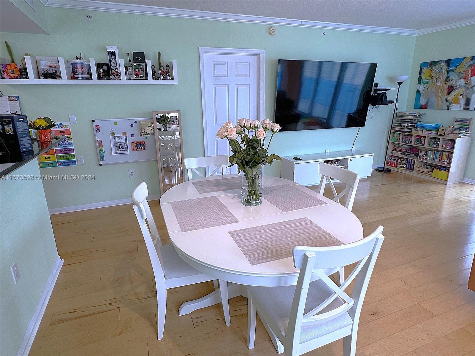 2080 South Ocean Drive, Unit 1602 Hallandale Beach, FL 33009 - Photo 5 of 38 a dining room with furniture and wooden floor