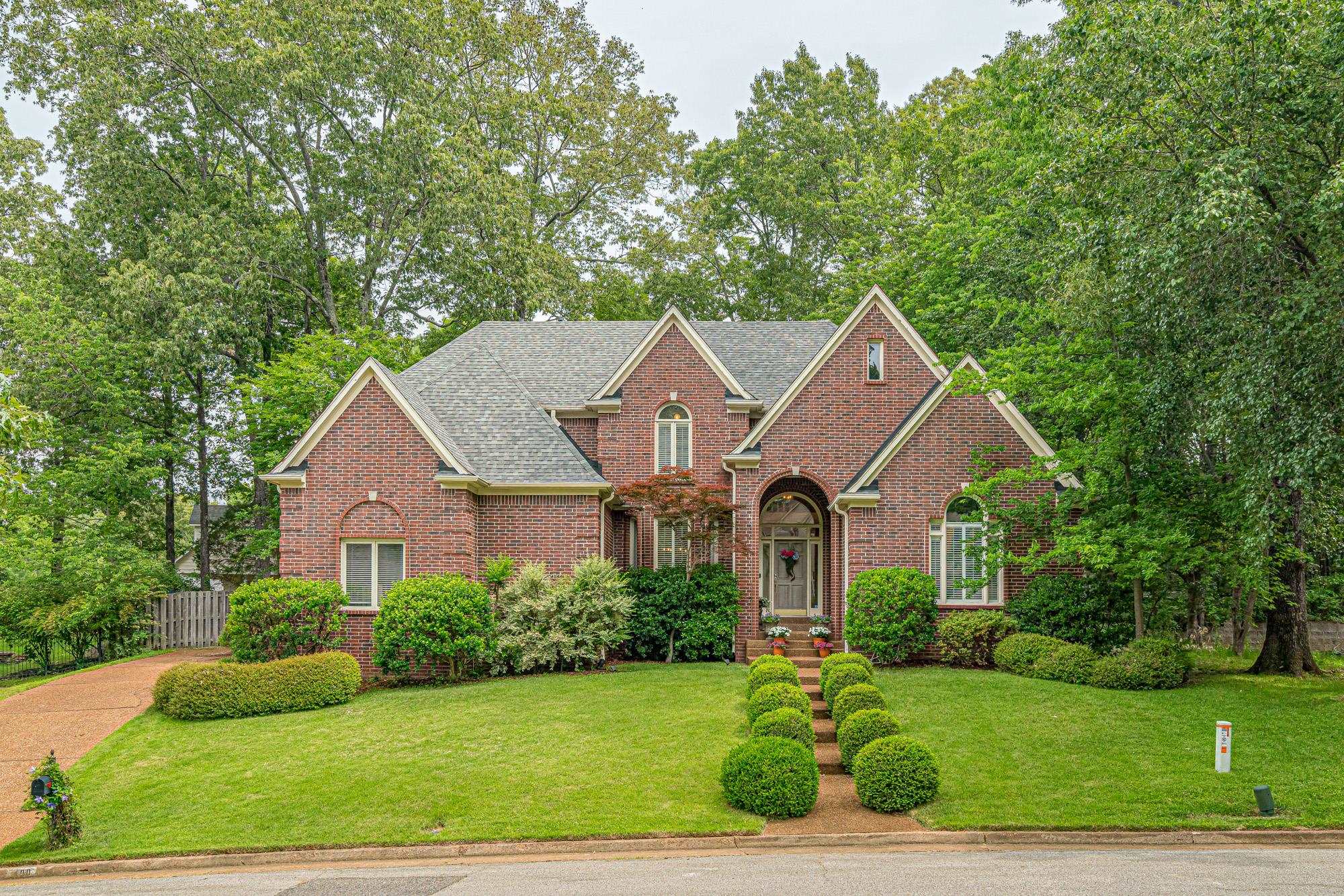 490 Brook Ridge Circle Memphis, TN 38018 - Photo 1 of 25 a front view of a house with a yard