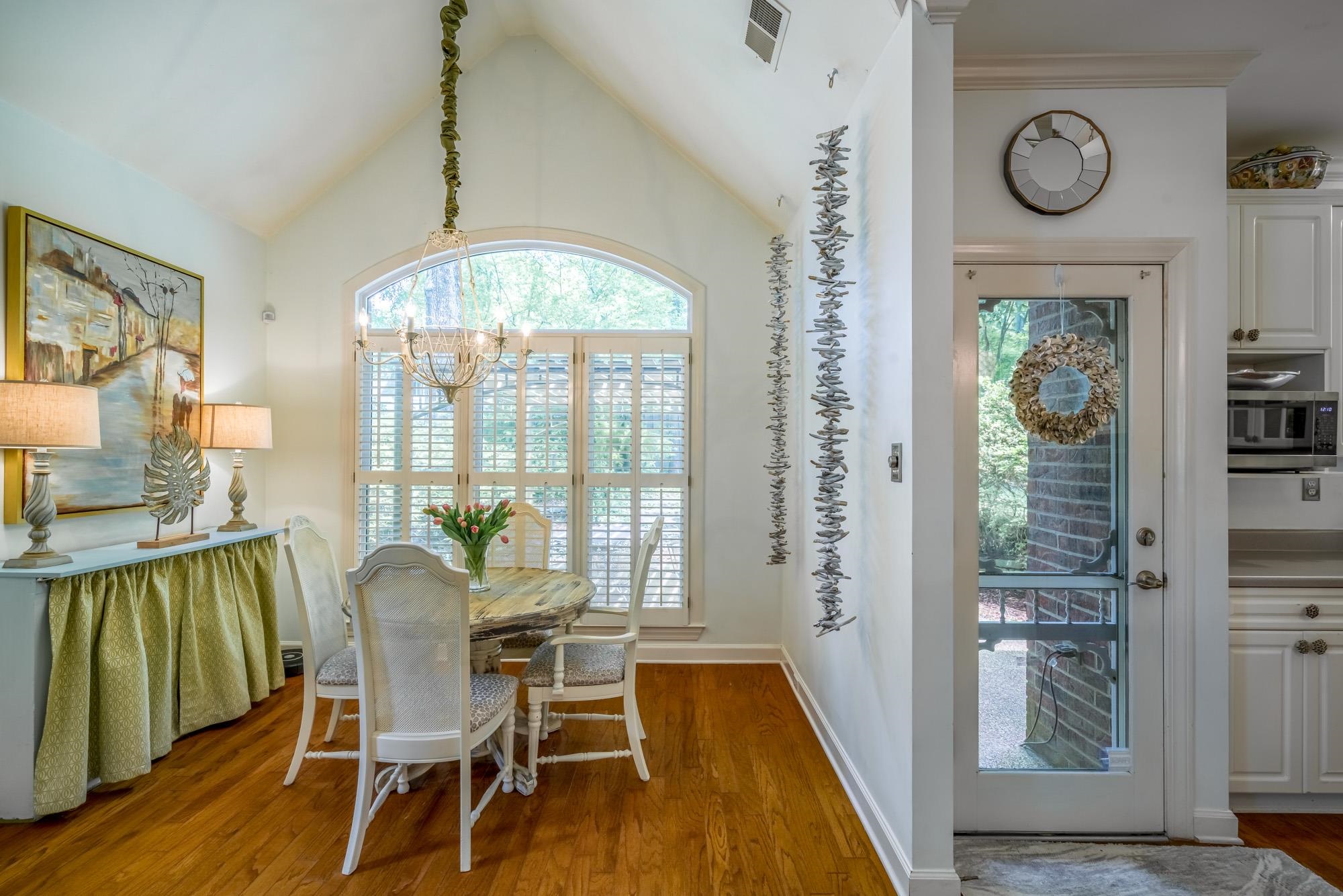 490 Brook Ridge Circle Memphis, TN 38018 - Photo 13 of 25 a dining room with furniture a chandelier and wooden floor