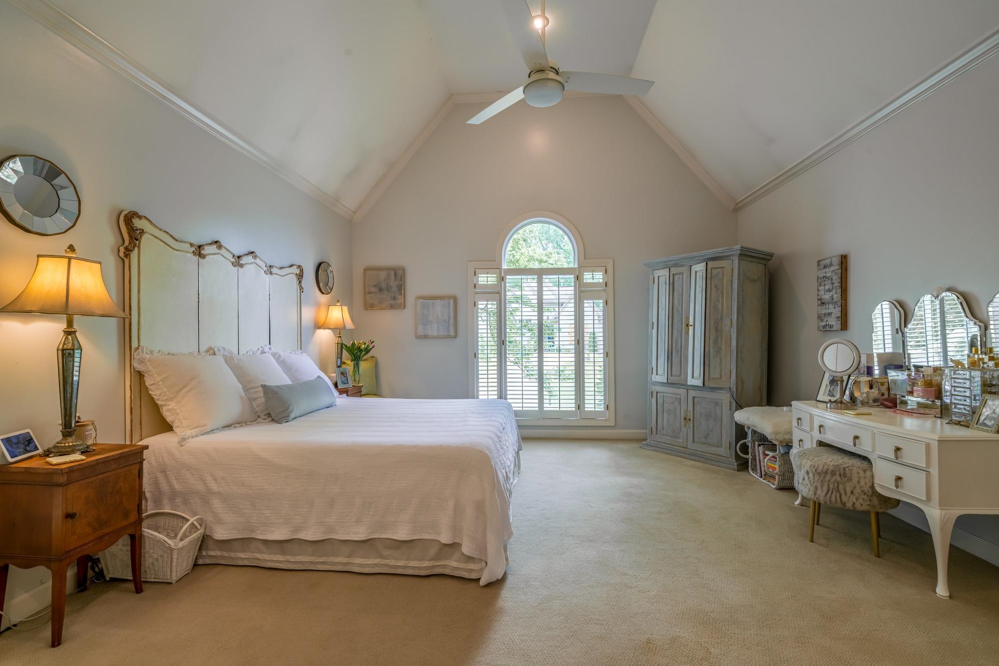 490 Brook Ridge Circle Memphis, TN 38018 - Photo 17 of 25 a spacious bedroom with a bed a chandelier and large window