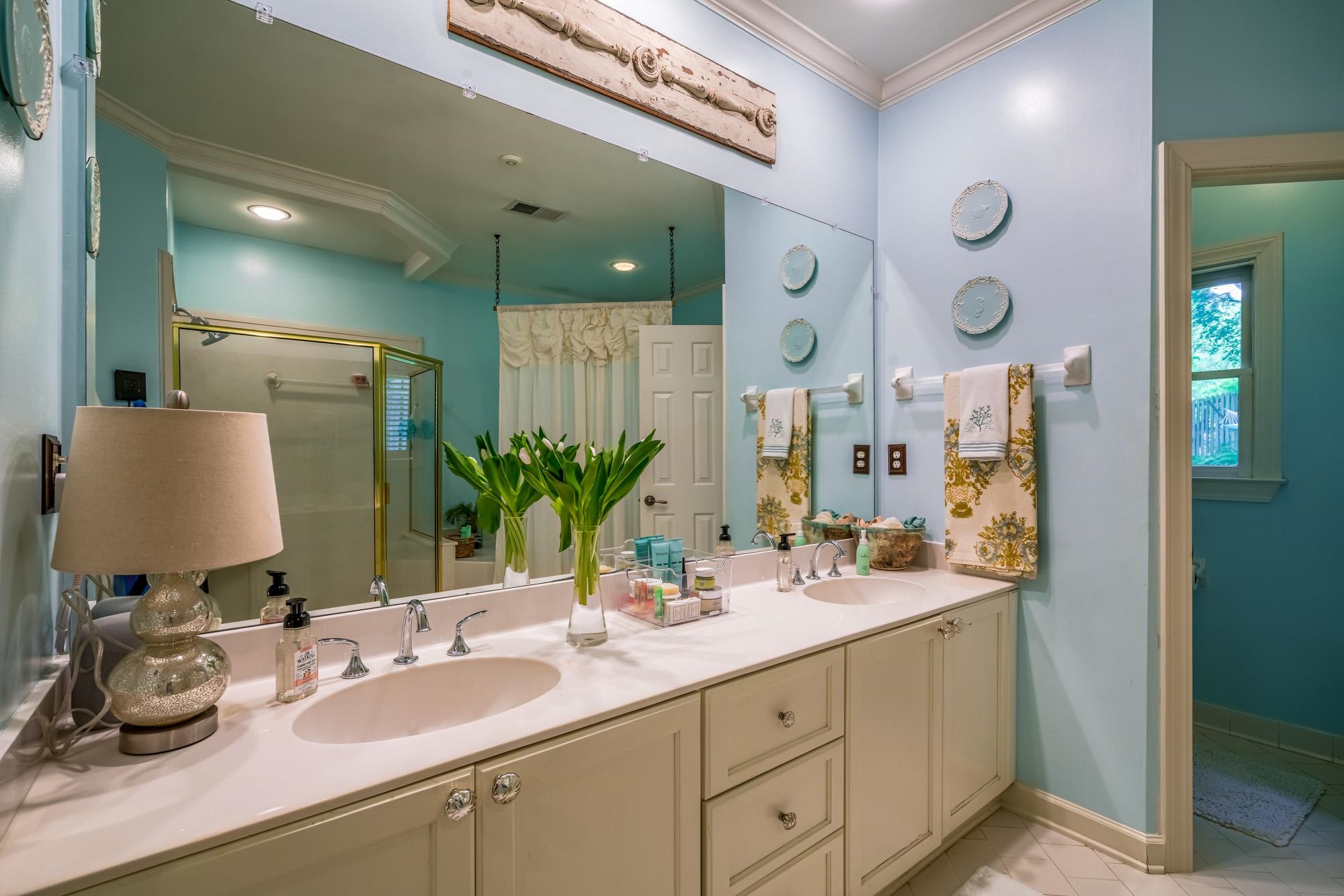 490 Brook Ridge Circle Memphis, TN 38018 - Photo 18 of 25 a bathroom with a double vanity sink and a mirror
