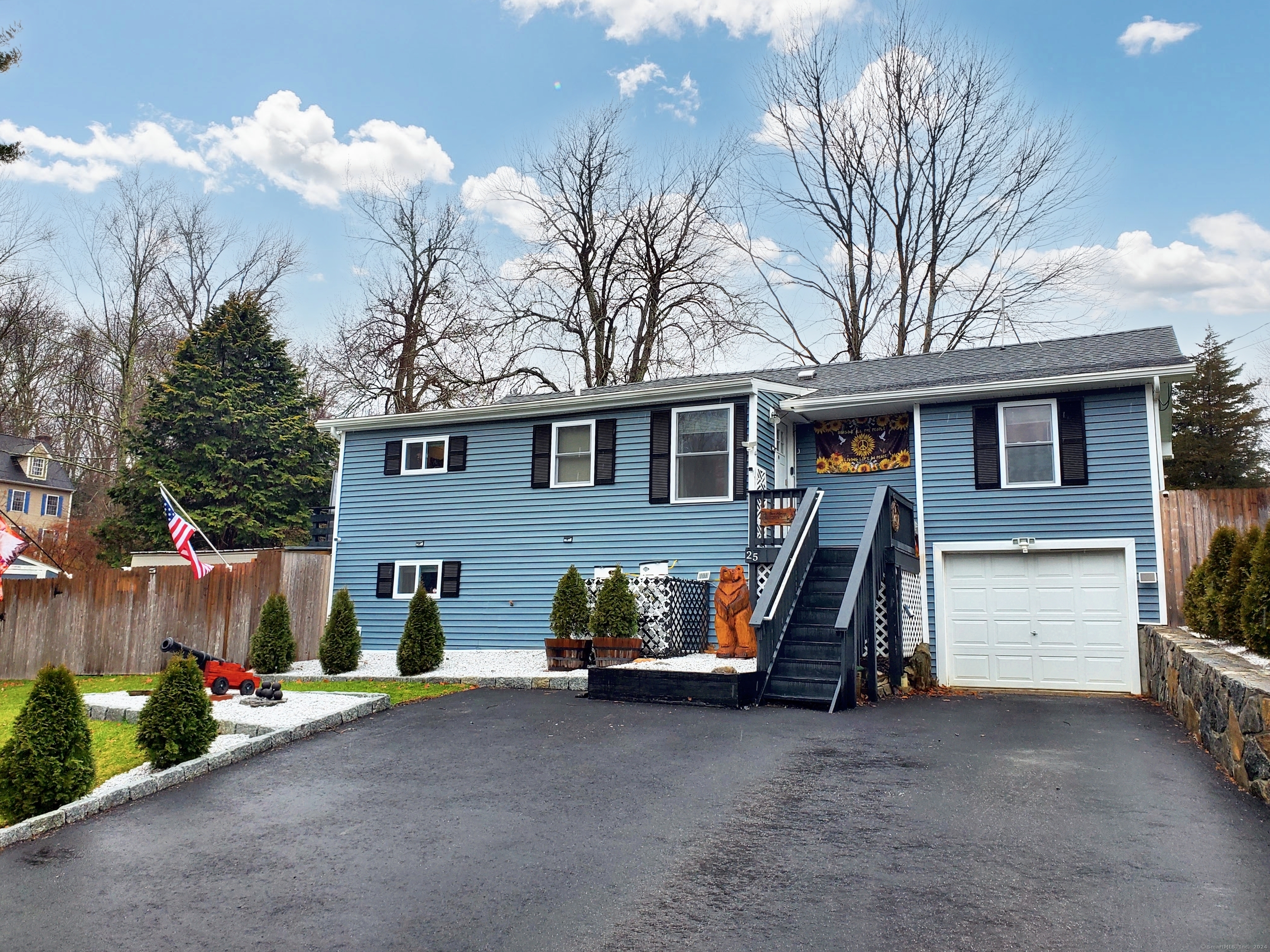 a view of a house with a yard and garage