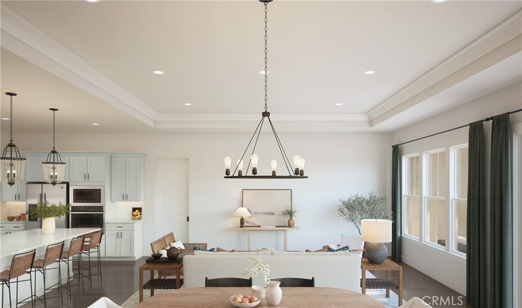 17244 Ta-Ki-Pi Road Apple Valley, CA 92307 - Photo 8 of 15 a living room with kitchen island furniture and a chandelier
