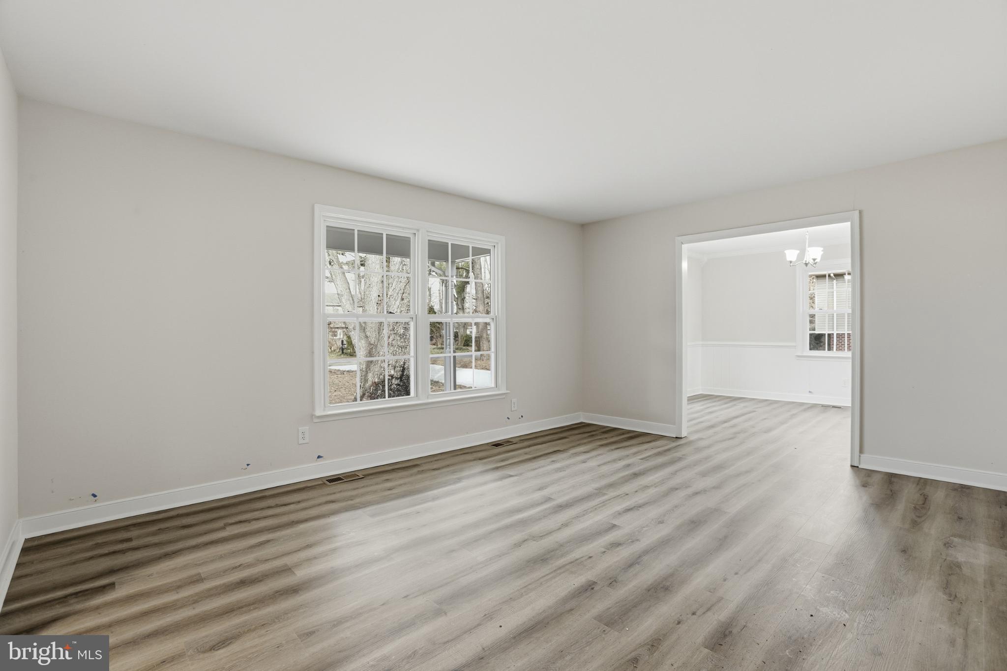 192 East Banbury Road Tappahannock, VA 22560 - Photo 13 of 50 an empty room with wooden floor and windows