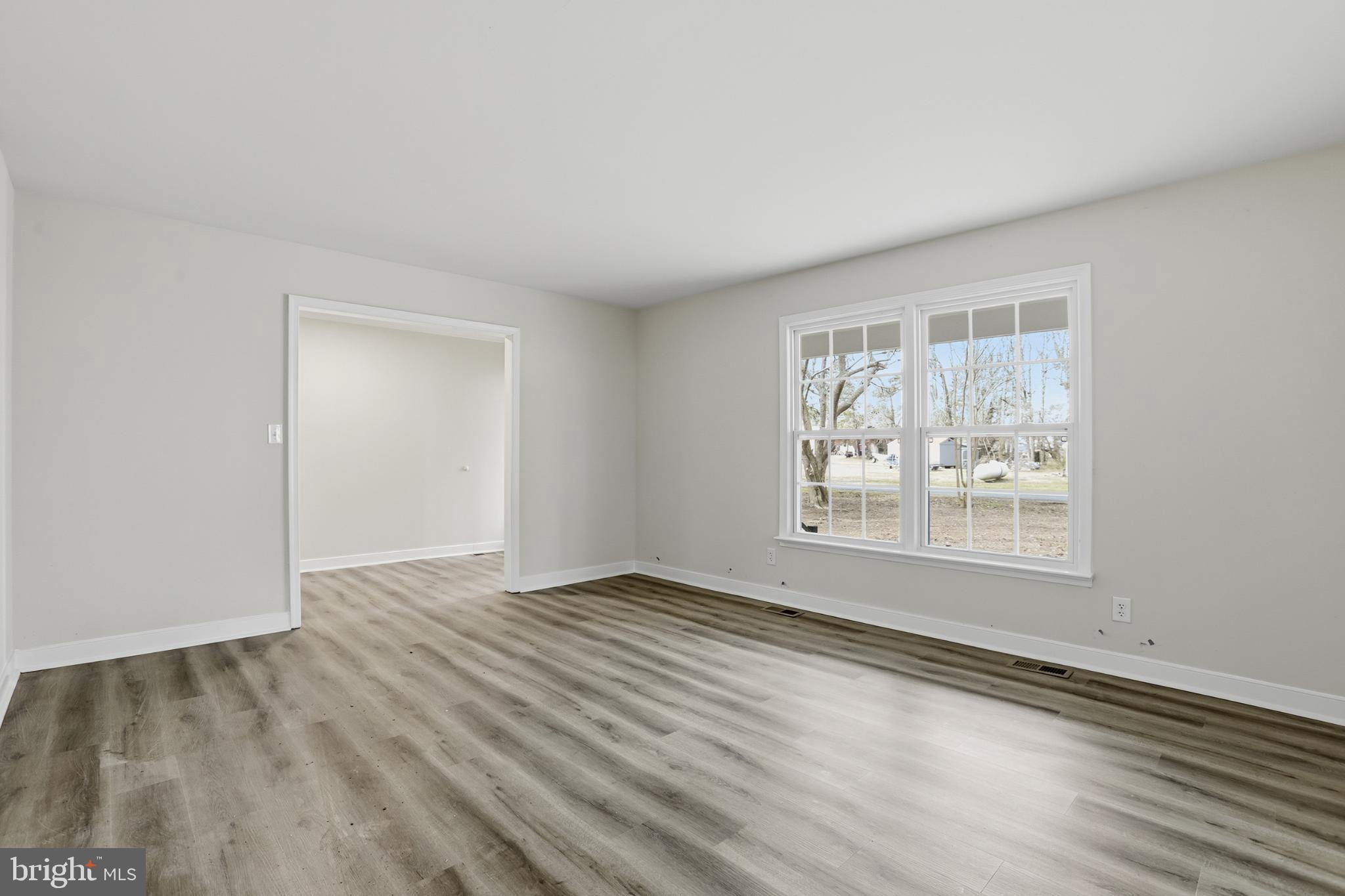 192 East Banbury Road Tappahannock, VA 22560 - Photo 15 of 50 an empty room with wooden floor and windows