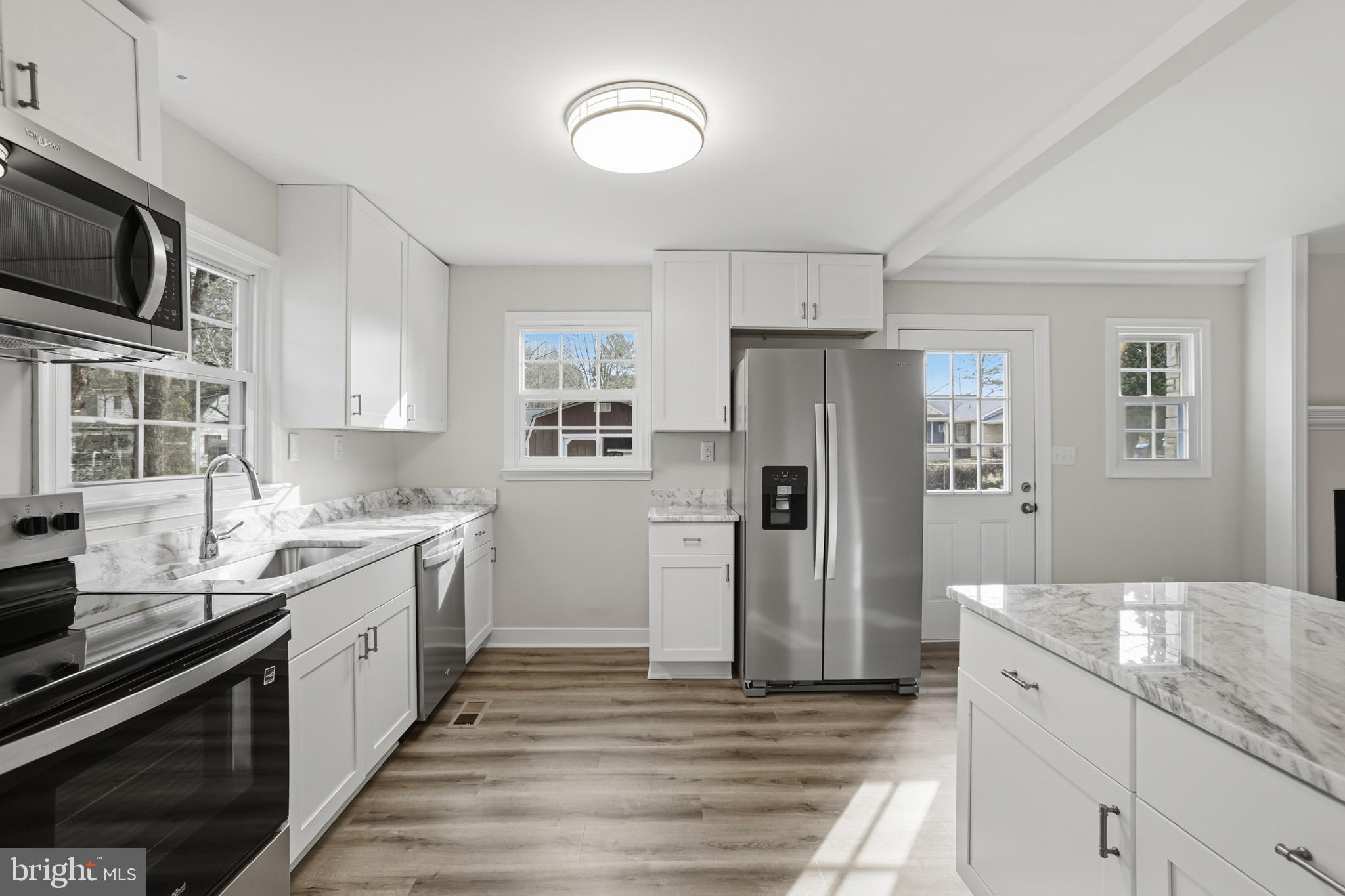 192 East Banbury Road Tappahannock, VA 22560 - Photo 18 of 50 a kitchen with a sink stove and refrigerator