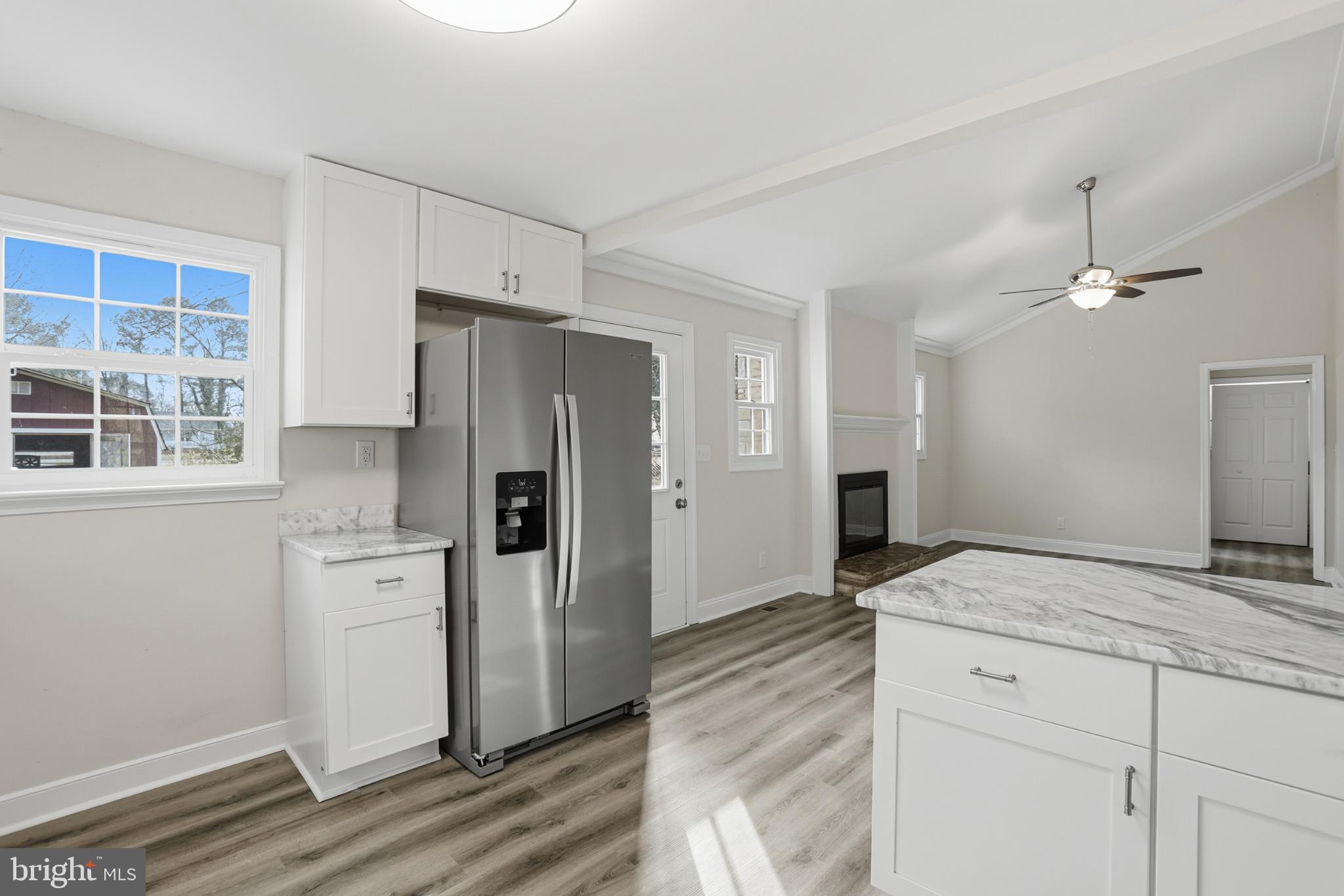 192 East Banbury Road Tappahannock, VA 22560 - Photo 21 of 50 a kitchen with granite countertop a refrigerator and a sink