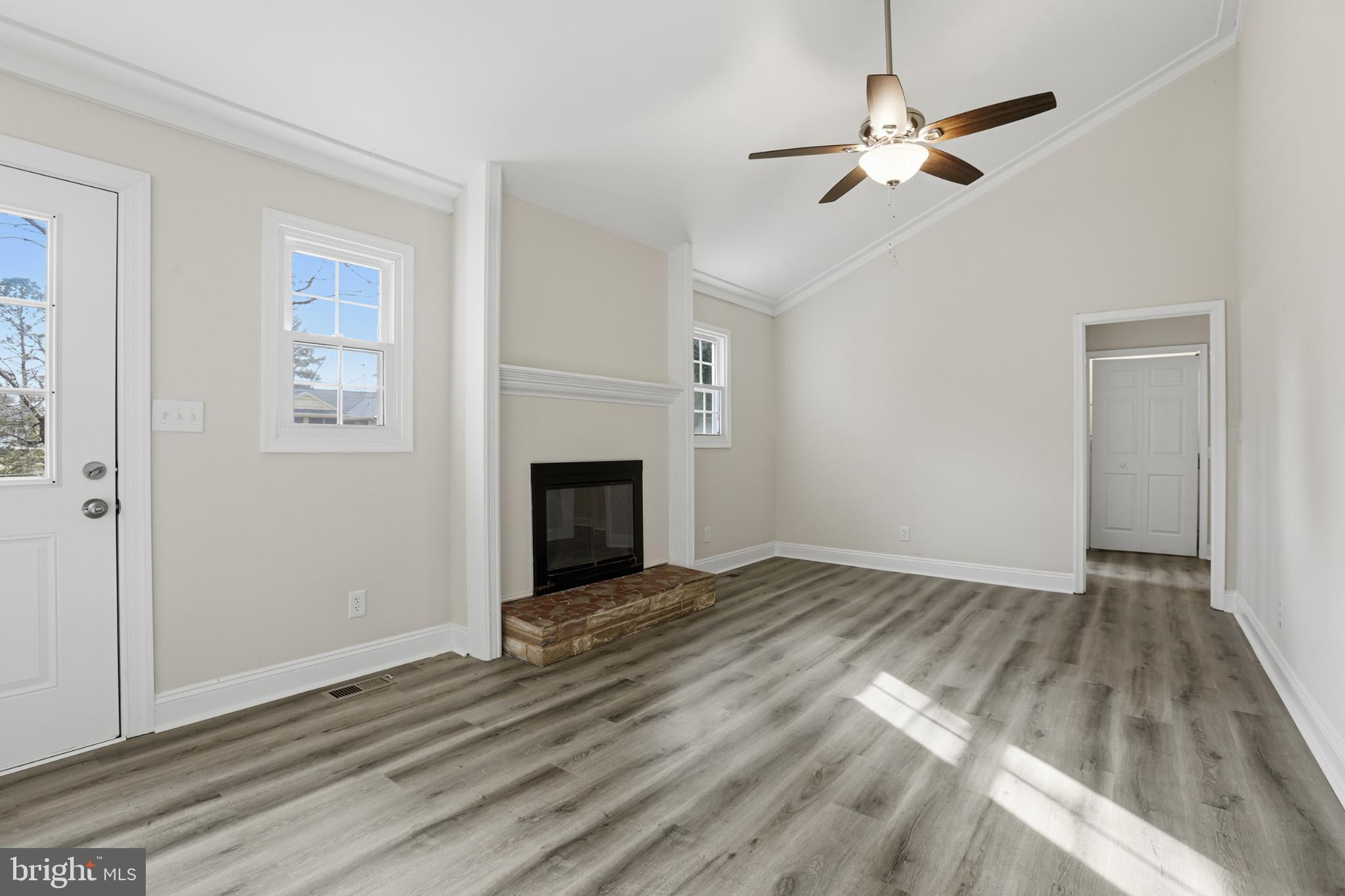 192 East Banbury Road Tappahannock, VA 22560 - Photo 23 of 50 an empty room with windows fireplace and a sink