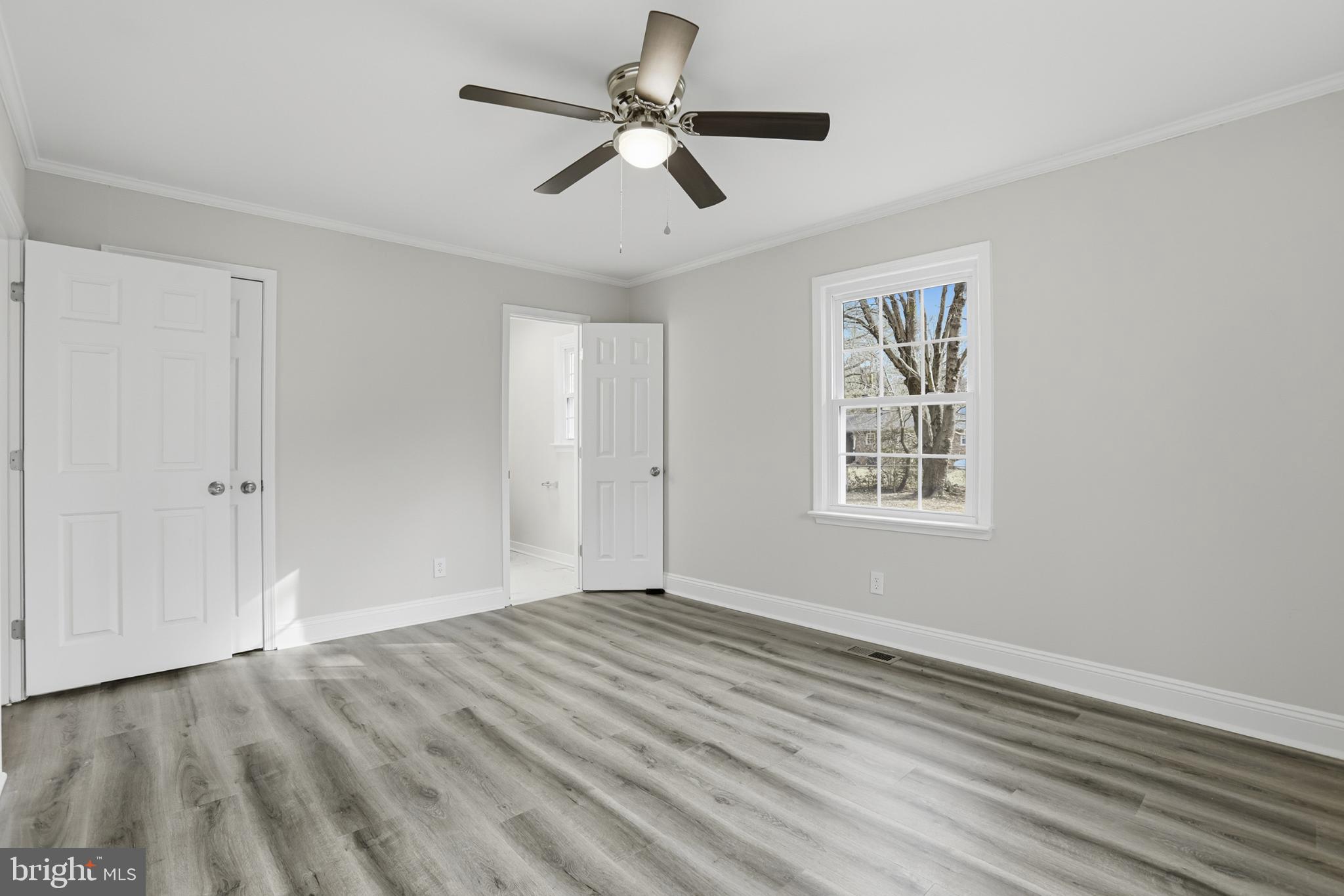192 East Banbury Road Tappahannock, VA 22560 - Photo 26 of 50 a view of empty room with wooden floor and fan