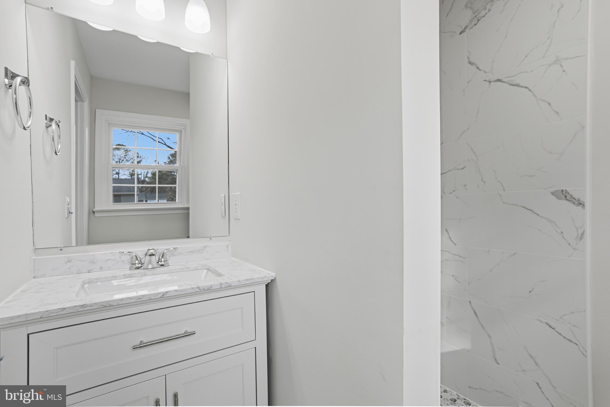 192 East Banbury Road Tappahannock, VA 22560 - Photo 30 of 50 a bathroom with a sink a vanity and a mirror
