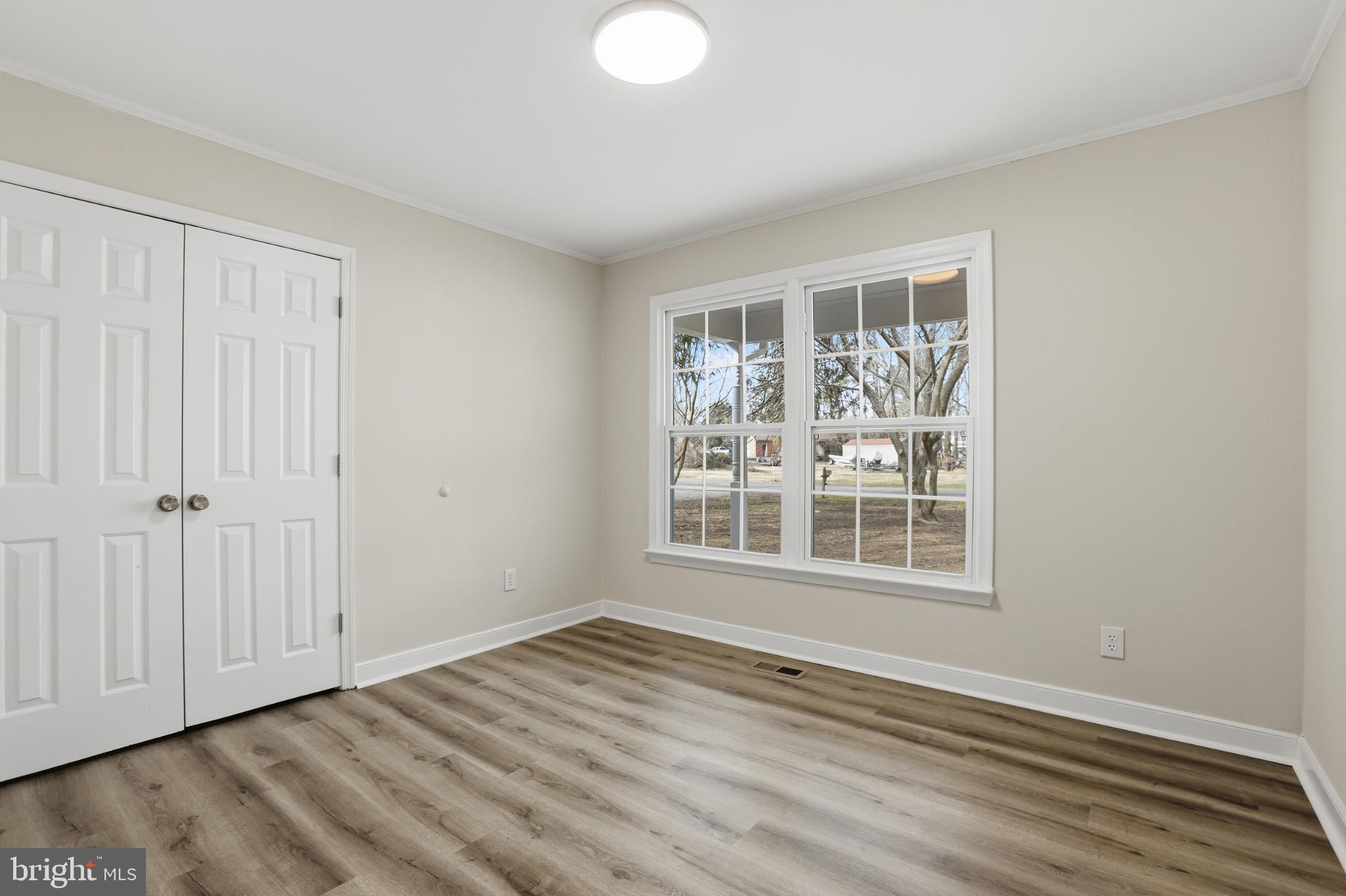 192 East Banbury Road Tappahannock, VA 22560 - Photo 31 of 50 a view of empty room with wooden floor and fan
