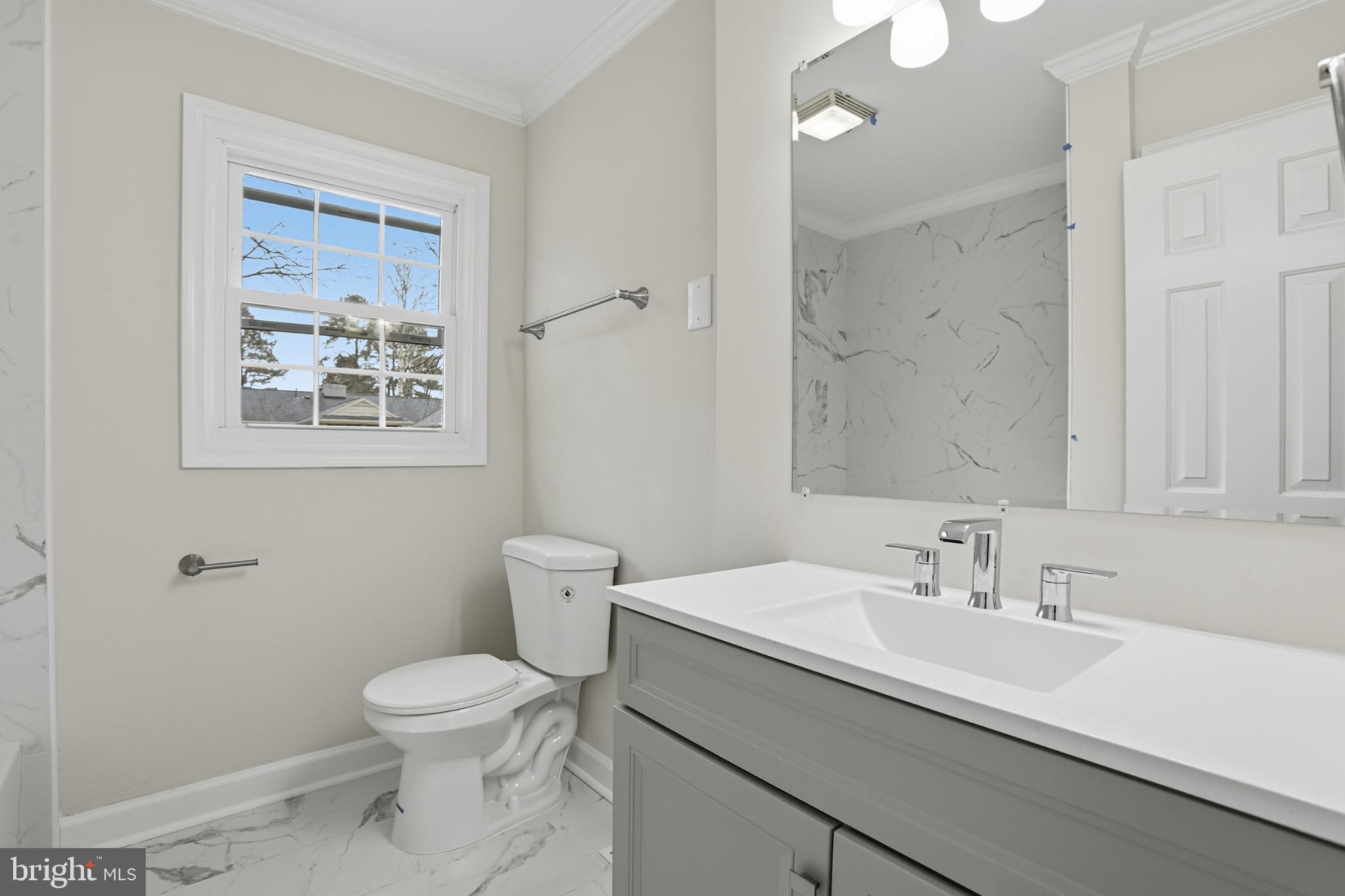 192 East Banbury Road Tappahannock, VA 22560 - Photo 37 of 50 a bathroom with a sink toilet and a mirror