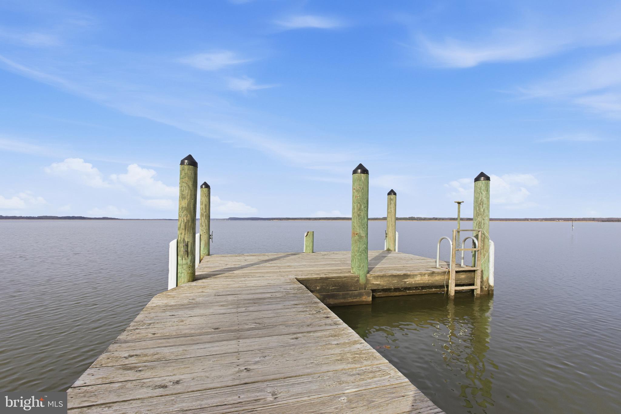 192 East Banbury Road Tappahannock, VA 22560 - Photo 45 of 50 a view of a lake with a table and chairs