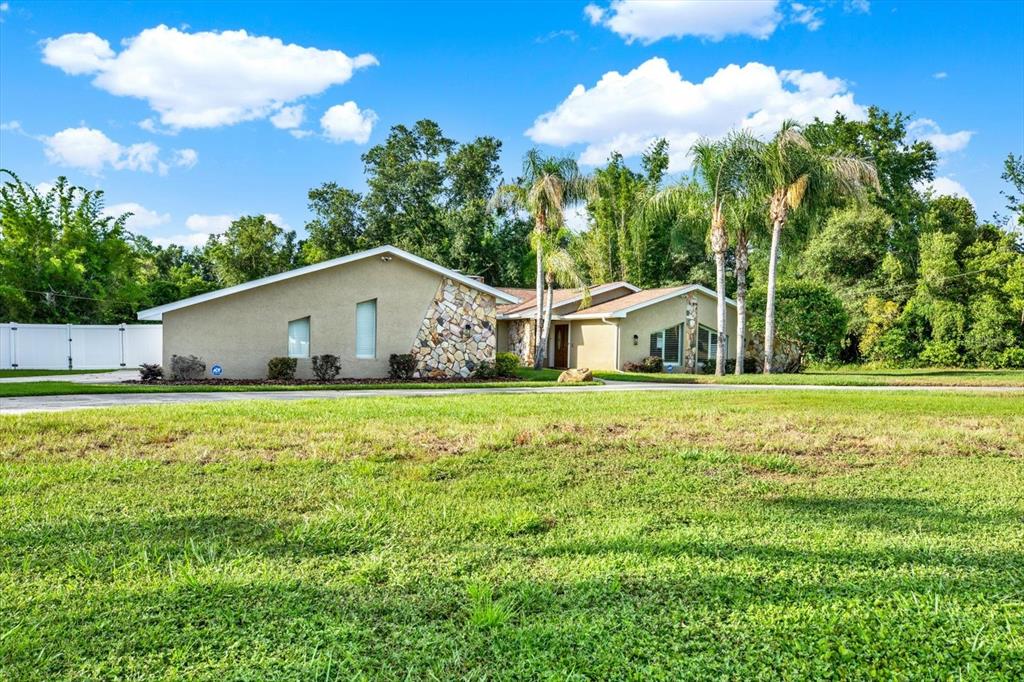 7487 River Country Drive Weeki Wachee, FL 34607 - Photo 50 of 53 a view of a house with a yard