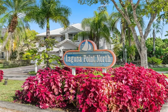 an aerial view of a house with a lake view