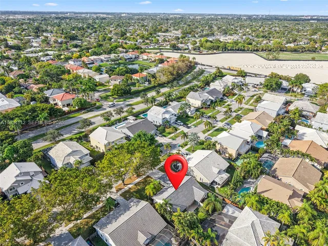 a view of a patio with table and chairs and potted plants