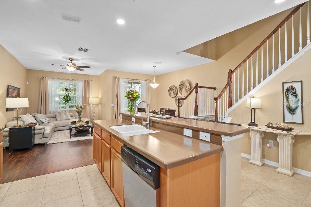 2417 Passamonte Drive, Unit 1E Winter Park, FL 32792 - Photo 6 of 15 a kitchen with stainless steel appliances granite countertop a sink and stove