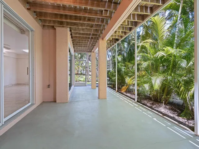 a view of a house with backyard porch and sitting area
