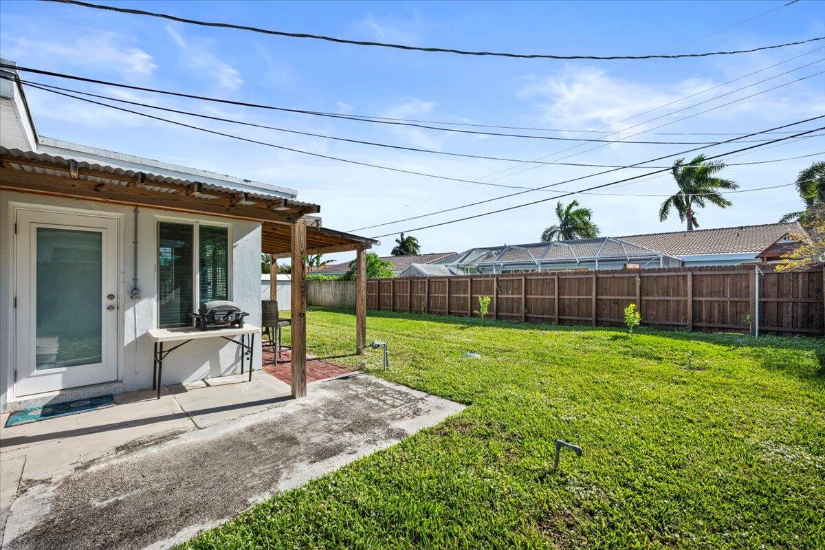 414 Northeast 26th Terrace Boca Raton, FL 33431 - Photo 23 of 27 Backyard West Side