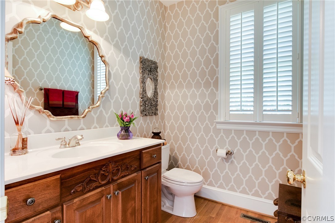 3660 Lansdowne Road Midlothian, VA 23113 - Photo 22 of 50 a bathroom with a sink a toilet and mirror
