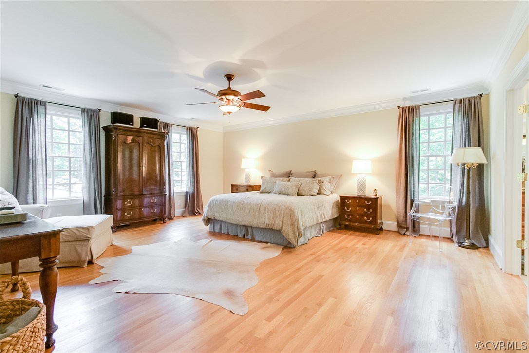 3660 Lansdowne Road Midlothian, VA 23113 - Photo 26 of 50 a spacious bedroom with a bed a dresser and wooden floor