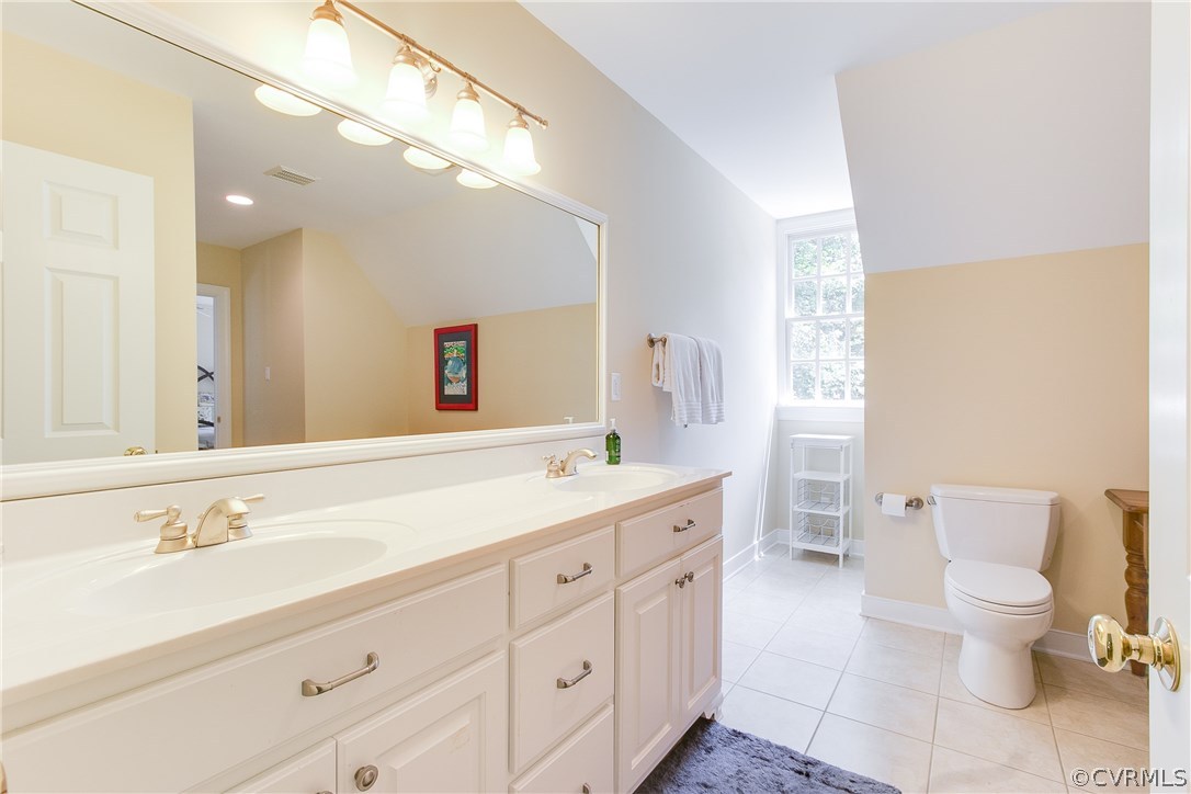 3660 Lansdowne Road Midlothian, VA 23113 - Photo 32 of 50 a spacious bathroom with a double vanity sink a mirror and a toilet