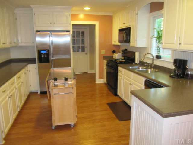 9420 Springdale Drive Raleigh, NC 27613 - Photo 5 of 25 Large Kitchen with Lots of Counter and Cabinet Space. New Owner Can Have Gas or Electric Stove. Kitchen