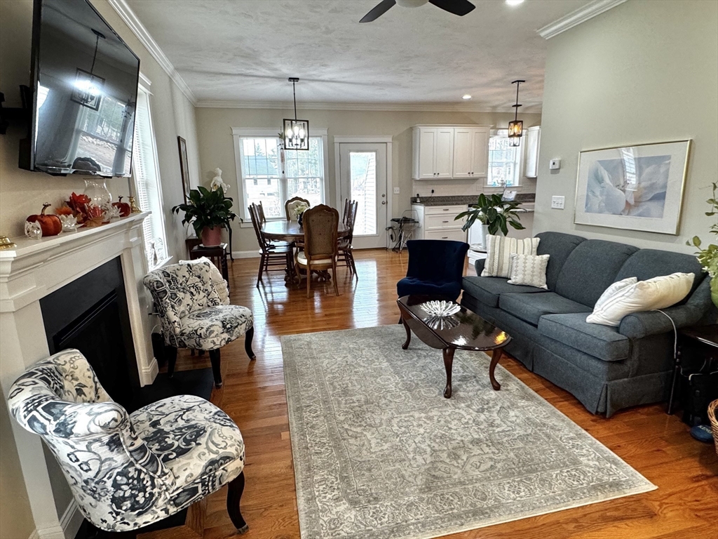 6 Nautical Way, Unit 122 Douglas, MA 01516 - Photo 12 of 42 a living room with furniture and a fireplace